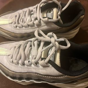 A pair of Size 4 Nike Air Shoes